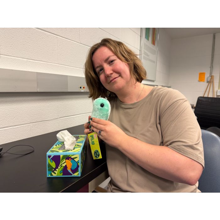 Holding Flu plush and tissues