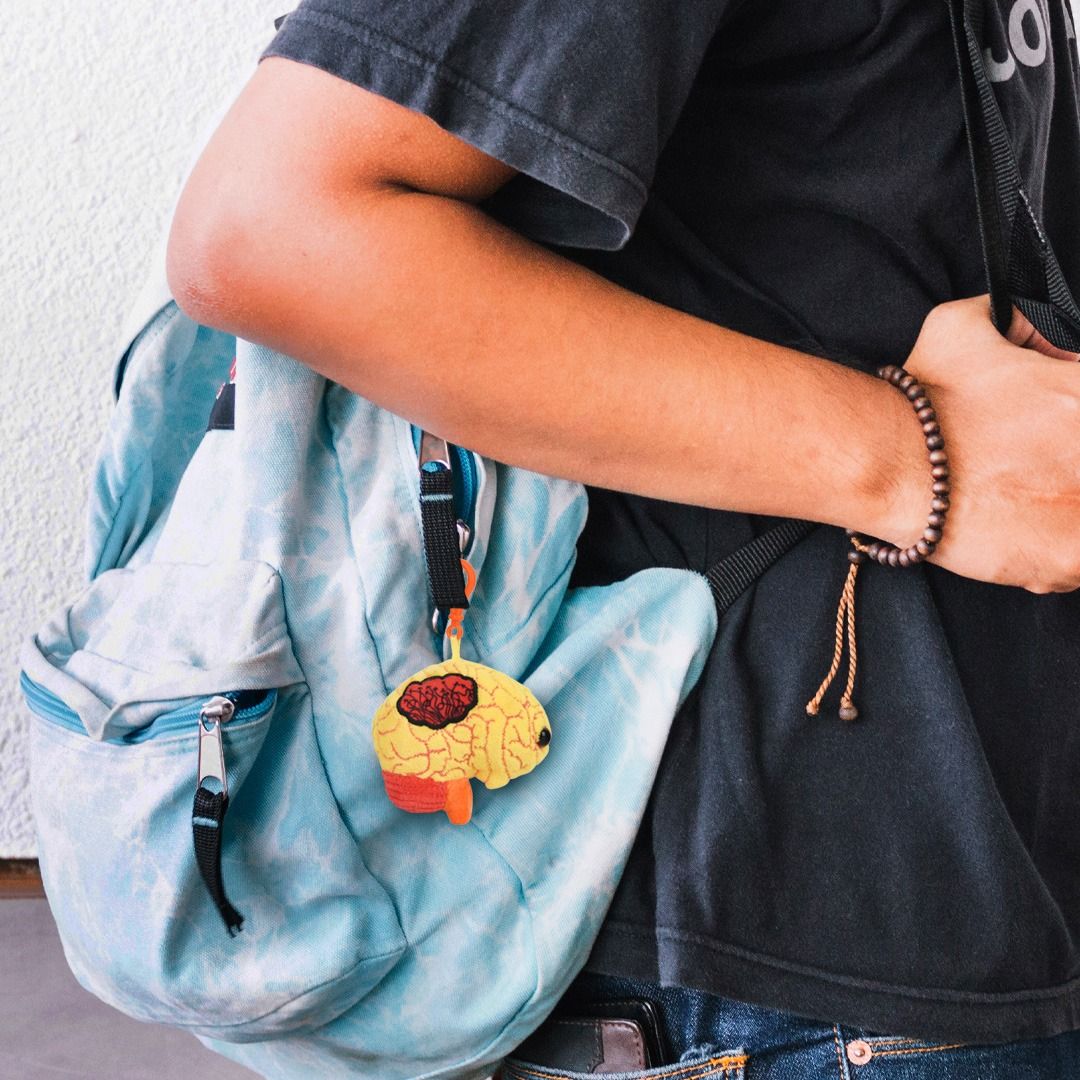 Autism key chain on boy's backpack