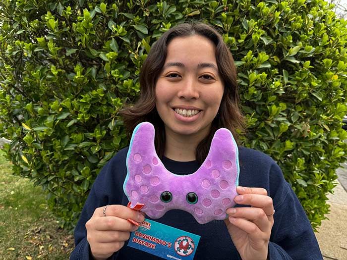 Model with Hashimoto plush purple