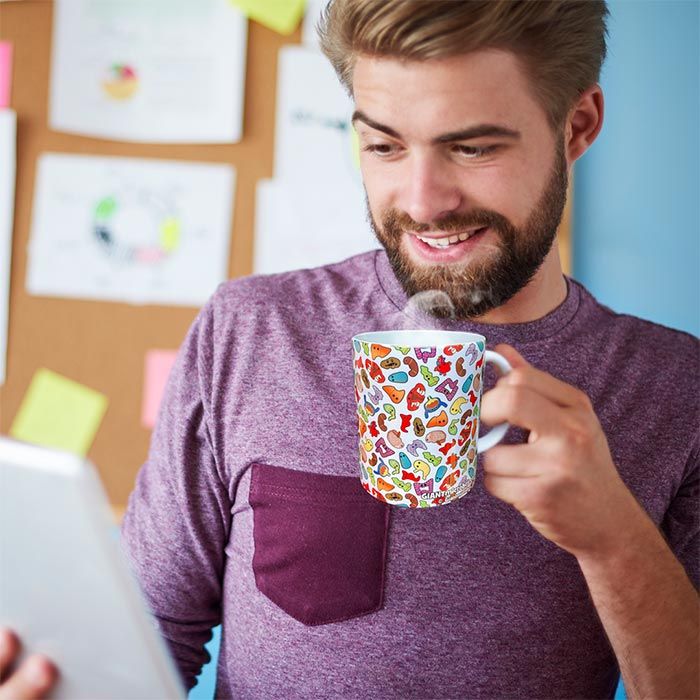 Guy enjoying coffee with organs mug