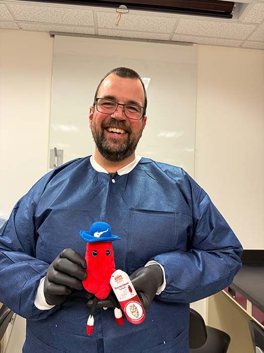 Testosterone plush with lab tech