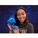 Waterbear plush in space with woman